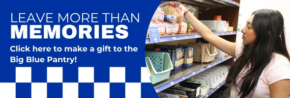 Woman selecting food from a donation shelf